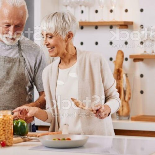 happy and healthy seniors prepare vegan food at home
