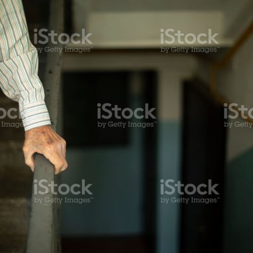 Old man leans on handrail. Old man goes down stairs. Entrance details. Inside house.